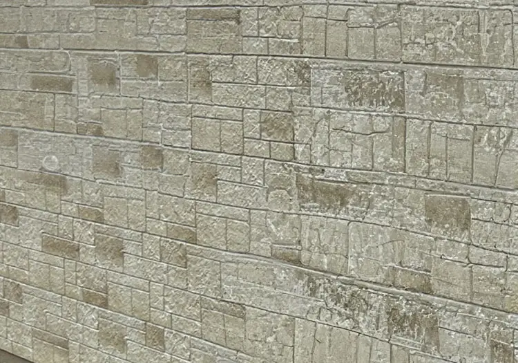 STONE-CLADS - All Seasons Steel Buildings Beige stone brick wall with rectangular blocks and weathered texture.